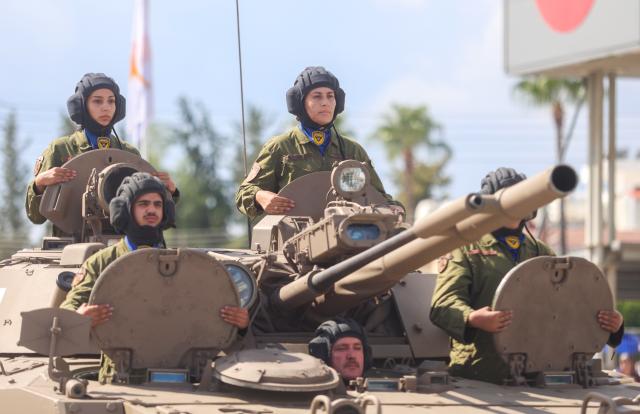 (261001) -- NICOSIA, Oct. 1, 2026 (Xinhua) -- Tank crew members of the Cypriot National Guard take part in a military parade celebrating the 66th anniversary of independence of Cyprus in Nicosia, Cyprus, Oct. 1, 2026. (Photo by George Christophorou/Xinhua)