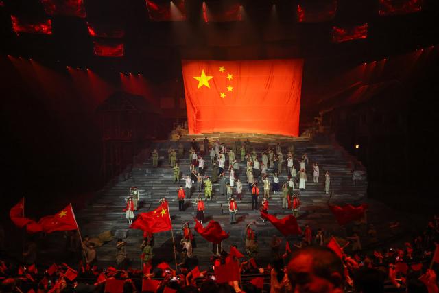 (261001) -- CHONGQING, Oct. 1, 2026 (Xinhua) -- People watch a stage show "Chongqing 1949" in southwest China's Chongqing on Oct. 1, 2026. People across China stepped out to fully enjoy their leisure time during the National Day holiday. (Xinhua/Huang Wei)