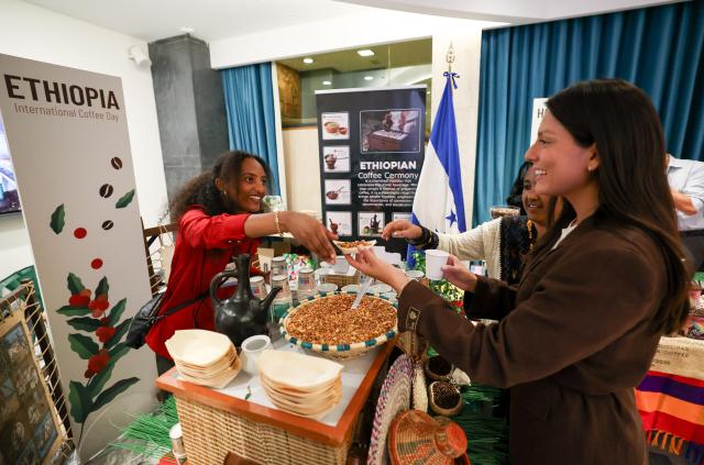 (261001) -- ROME, Oct. 1, 2026 (Xinhua) -- A visitor tries coffee snack at the Ethiopia booth during the Coffee Tasting Experience event of the International Coffee Day 2026 in Rome, Italy, Oct. 1, 2026. The Food and Agriculture Organization of the United Nations (FAO) marked the first observance of International Coffee Day in Rome on Thursday.
International Coffee Day was officially designated by the United Nations General Assembly on March 10, 2026. (Xinhua/Wang Kaiyan)