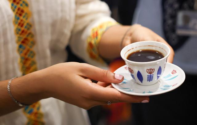 (261001) -- ROME, Oct. 1, 2026 (Xinhua) -- A staff member at the Ethiopia booth serves coffee to a visitor during the Coffee Tasting Experience event of the International Coffee Day 2026 in Rome, Italy, Oct. 1, 2026. The Food and Agriculture Organization of the United Nations (FAO) marked the first observance of International Coffee Day in Rome on Thursday.
International Coffee Day was officially designated by the United Nations General Assembly on March 10, 2026. (Xinhua/Wang Kaiyan)