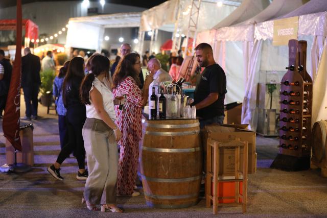 (261001) -- BEIRUT, Oct. 1, 2026 (Xinhua) -- Visitors taste wine at Vinifest, a wine festival, in Beirut, Lebanon, Oct. 1, 2026. (Xinhua/Bilal Jawich)