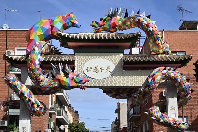 (261001) -- MADRID, Oct. 1, 2026 (Xinhua) -- Photo taken on Oct. 1, 2026 shows the Chinese archway in Usera district of Madrid, Spain. A Chinese archway featuring two dragons and Madrid's emblematic bear was unveiled Thursday in the Usera district of the Spanish capital, celebrating the neighborhood's cultural diversity and the ties with its Chinese community. (Xinhua/Cheng Min)