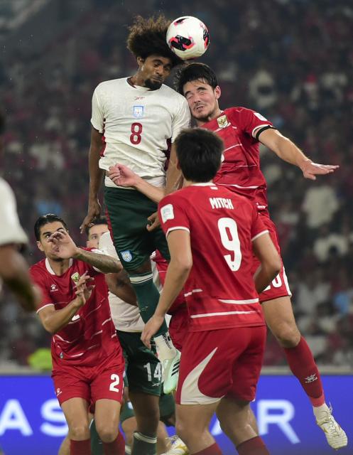 (261002) -- JAKARTA, Oct. 2, 2026 (Xinhua) -- Elkan Baggott (top R) of Indonesia vies with Hamza Choudhury of Bangladesh during the FIFA ASEAN Cup 2026 Division 1 Group A match between Indonesia and Bangladesh at Gelora Bung Karno Stadium in Jakarta, Indonesia, Oct. 1, 2026. (Xinhua/Zulkarnain)