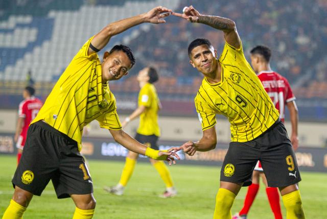 (261002) -- BANDUNG, Oct. 2, 2026 (Xinhua) -- Arif Aiman (L) and Bergson of Malaysia celebrate after scoring during the FIFA ASEAN Cup 2026 Division 1 Group A match between Malaysia and Singapore at Si Jalak Harupat Stadium, in Bandung, West Java, Indonesia, Oct. 1, 2026. (Photo by Septianjar Muharam/Xinhua)