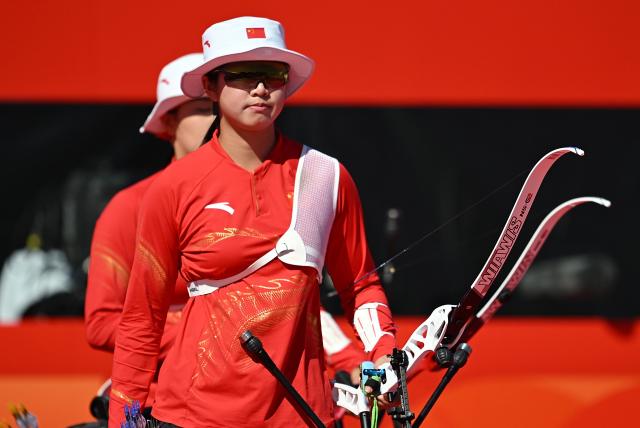(261002) -- OKAZAKI, Oct. 2, 2026 (Xinhua) -- Zhu Jingyi of team China reacts during the recurve women's team bronze medal match of archery against team Indonesia at the 20th Asian Games Aichi-Nagoya 2026 in Okazaki of Aichi Prefecture, Japan, Oct. 2, 2026. (Xinhua/Yu Yang)