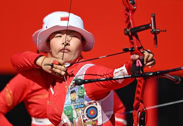 (261002) -- OKAZAKI, Oct. 2, 2026 (Xinhua) -- Huang Yuwei of team China competes during the recurve women's team bronze medal match of archery against team Indonesia at the 20th Asian Games Aichi-Nagoya 2026 in Okazaki of Aichi Prefecture, Japan, Oct. 2, 2026. (Xinhua/Yu Yang)