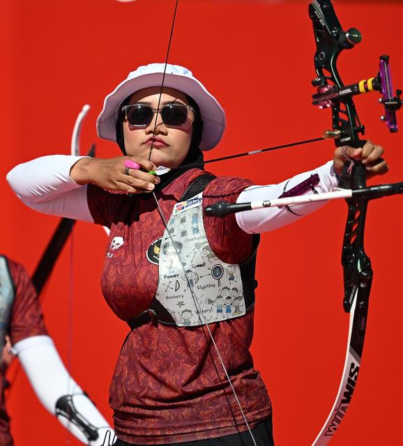 (261002) -- OKAZAKI, Oct. 2, 2026 (Xinhua) -- Diananda Choirunisa of team Indonesia competes during the recurve women's team bronze medal match of archery against team China at the 20th Asian Games Aichi-Nagoya 2026 in Okazaki of Aichi Prefecture, Japan, Oct. 2, 2026. (Xinhua/Yu Yang)