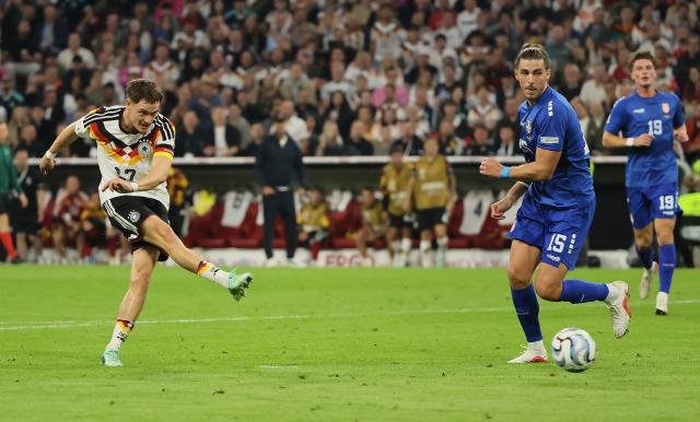 (261002) -- MUNICH, Oct. 2, 2026 (Xinhua) -- Florian Wirtz (L) of Germany shoots to score during the UEFA Nations League 2026/27 League A Group A2 match between Germany and Serbia in Munich, Germany, Oct. 1, 2026. (Photo by Philippe Ruiz/Xinhua)