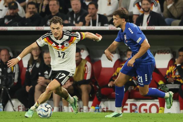 (261002) -- MUNICH, Oct. 2, 2026 (Xinhua) -- Florian Wirtz (L) of Germany vies with Lazar Vujadin Samardzic of Serbia during the UEFA Nations League 2026/27 League A Group A2 match between Germany and Serbia in Munich, Germany, Oct. 1, 2026. (Photo by Philippe Ruiz/Xinhua)