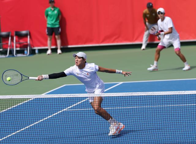 (261002) -- NAGOYA, Oct. 2, 2026 (Xinhua) -- Kusuhara Yusuke/Nakagawa Shunsuke (front) of Japan compete during the men's doubles Gold Medal Match of tennis between Kusuhara Yusuke/Nakagawa Shunsuke of Japan and Nam Jisung/Park Uisung of South Korea at the 20th Asian Games Aichi-Nagoya 2026 in Nagoya, Japan, Oct. 2, 2026. (Xinhua/Li Bo)