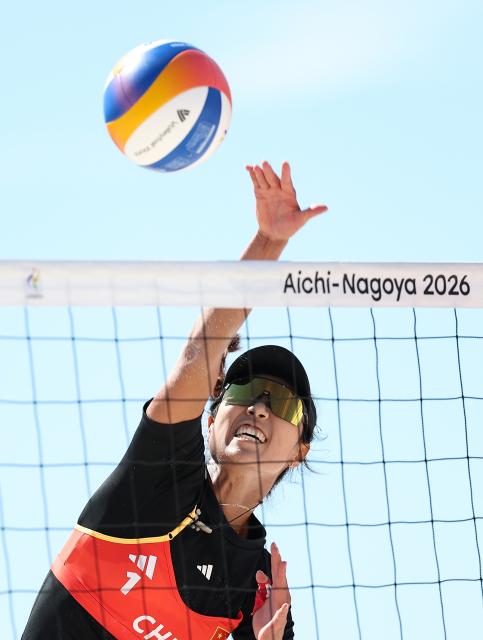 (261002) -- HEKINAN, Oct. 2, 2026 (Xinhua) -- Cao Shuting of China spikes the ball during the Women's Beach Volleyball Bronze Medal Match between Cao Shuting/Dong Jie of China and Khylem Harl Progella/Sofiah Shanine Pagara of the Philippines at the 20th Asian Games Aichi-Nagoya 2026 in Hekinan of Aichi Prefecture, Japan, Oct. 2, 2026. (Xinhua/Luo Yuan)