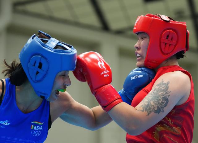 (261002) -- NISHIO, Oct. 2, 2026 (Xinhua) -- Bao Ziyi (R) of China competes with Lovlina Borgohain of India during their women's 75kg final bout of boxing at the 20th Asian Games Aichi-Nagoya 2026 in Nishio of Aichi Prefecture, Japan, Oct. 2, 2026. (Xinhua/Chen Zeguo)