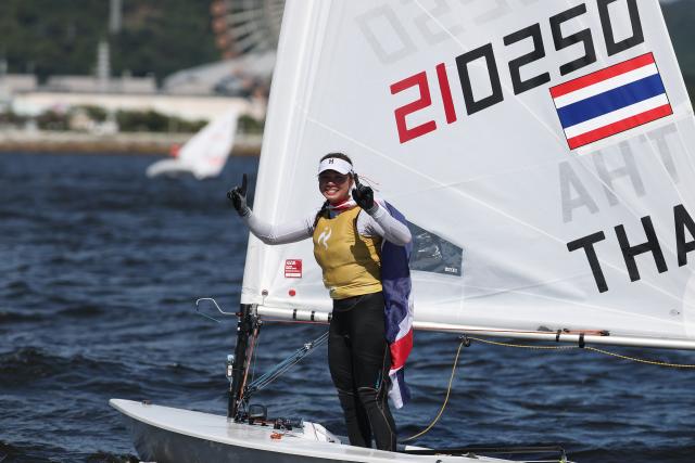 (261002) --  GAMAGORI, Oct. 2, 2026 (Xinhua) -- Sophia Montgomery of Thailand celebrates after the Women's Dinghy Final of Sailing at the 20th Asian Games Aichi-Nagoya 2026 in Gamagori of Aichi Prefecture, Japan, Oct. 2, 2026. (Xinhua/Deng Hua)