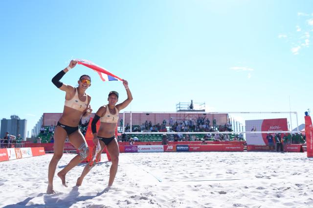 (261002) -- HEKINAN, Oct. 2, 2026 (Xinhua) -- Taravadee Naraphornrapat (R)/Worapeerachayakorn Kongphopsarutawadee of Thailand celebrate after winning the Women's Beach Volleyball Gold Medal Match between Xia Xinyi/Yan Xu of China and Taravadee Naraphornrapat/Worapeerachayakorn Kongphopsarutawadee of Thailand at the 20th Asian Games Aichi-Nagoya 2026 in Hekinan of Aichi Prefecture, Japan, Oct. 2, 2026. (Xinhua/Luo Yuan)