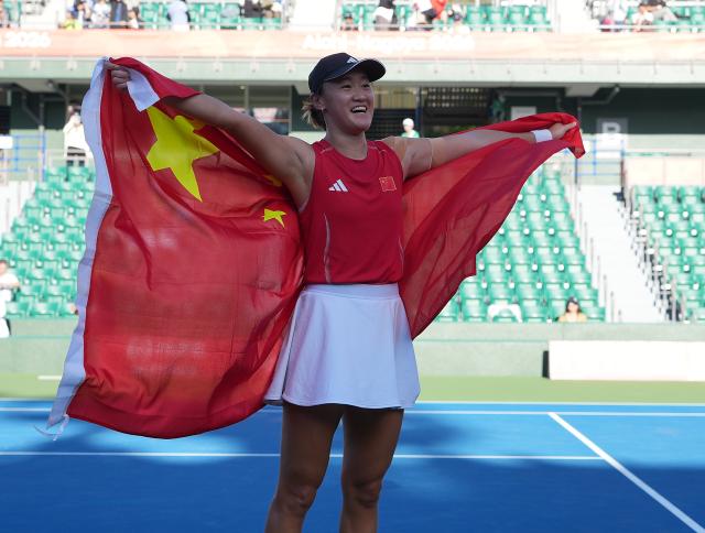 (261002) -- NAGOYA, Oct. 2, 2026 (Xinhua) -- Wang Xiyu celebrates after winning the women's singles Gold Medal Match of tennis between Wang Xiyu of China and Zhang Shuai of China at the 20th Asian Games Aichi-Nagoya 2026 in Nagoya, Japan, Oct. 2, 2026. (Xinhua/Li Bo)