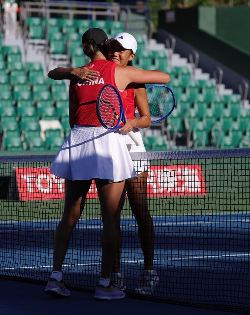 (261002) -- NAGOYA, Oct. 2, 2026 (Xinhua) -- Wang Xiyu (L) hugs Zhang Shuai after the women's singles Gold Medal Match of tennis between Wang Xiyu of China and Zhang Shuai of China at the 20th Asian Games Aichi-Nagoya 2026 in Nagoya, Japan, Oct. 2, 2026. (Xinhua/Li Bo)