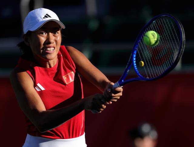 (261002) -- NAGOYA, Oct. 2, 2026 (Xinhua) -- Zhang Shuai hits a return during the women's singles Gold Medal Match of tennis between Wang Xiyu of China and Zhang Shuai of China at the 20th Asian Games Aichi-Nagoya 2026 in Nagoya, Japan, Oct. 2, 2026. (Xinhua/Li Bo)