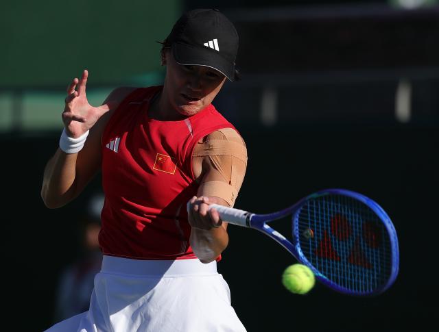 (261002) -- NAGOYA, Oct. 2, 2026 (Xinhua) -- Wang Xiyu hits a return during the women's singles Gold Medal Match of tennis between Wang Xiyu of China and Zhang Shuai of China at the 20th Asian Games Aichi-Nagoya 2026 in Nagoya, Japan, Oct. 2, 2026. (Xinhua/Li Bo)