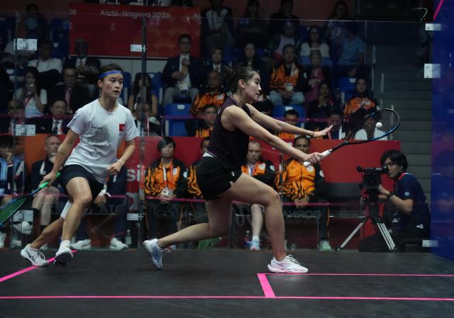 (261002) -- NAGOYA, Oct. 2, 2026 (Xinhua) -- Lee Ka Yi (L) of team China's Hong Kong competes against Aira Azman of team Malaysia during the Women's Team Gold Medal Match of Squash at the 20th Asian Games Aichi-Nagoya 2026 in Nagoya, Japan, Oct. 2, 2026. (Xinhua/Jia Yuchen)