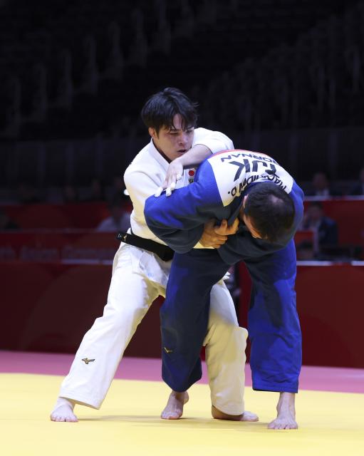 (261002) -- NAGOYA, Oct. 2, 2026 (Xinhua) -- Masuchi Ryotaro (L) of Japan vies with Dzhakhongir Madzhidov of Tajikistan during the men -100kg final of Judo at the 20th Asian Games Aichi-Nagoya 2026 in Nagoya, Japan, Oct. 2, 2026. (Xinhua/Yao Qilin)