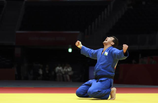 (261002) -- NAGOYA, Oct. 2, 2026 (Xinhua) -- Muzaffarbek Turoboyev of Uzbekistan celebrates victory against Ota Hyoga of Japan after the men +100kg final of Judo at the 20th Asian Games Aichi-Nagoya 2026 in Nagoya, Japan, Oct. 2, 2026. (Xinhua/Yao Qilin)