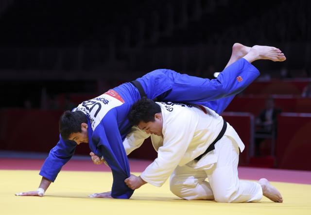 (261002) -- NAGOYA, Oct. 2, 2026 (Xinhua) -- Ota Hyoga (R) of Japan vies with Muzaffarbek Turoboyev of Uzbekistan during the men +100kg final of Judo at the 20th Asian Games Aichi-Nagoya 2026 in Nagoya, Japan, Oct. 2, 2026. (Xinhua/Yao Qilin)