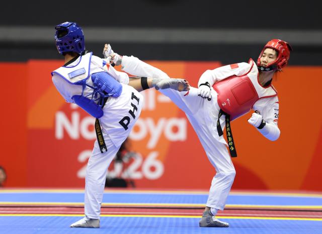 (261002) -- TOYOHASHI, Oct. 2, 2026 (Xinhua) -- Ma Jingyue (R) of China competes with Tachiana Keizha Mangin of the Philippines during the women -49kg final of taekwondo at the 20th Asian Games Aichi-Nagoya 2026 in Toyohashi of Aichi Prefecture, Japan, Oct. 2, 2026. (Xinhua/Wang Fei)