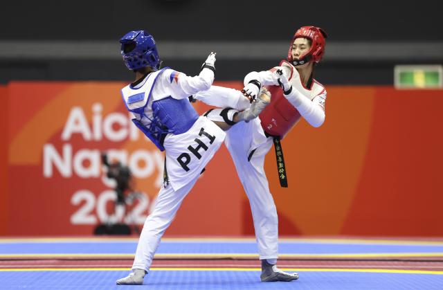 (261002) -- TOYOHASHI, Oct. 2, 2026 (Xinhua) -- Ma Jingyue (R) of China competes with Tachiana Keizha Mangin of the Philippines during the women -49kg final of taekwondo at the 20th Asian Games Aichi-Nagoya 2026 in Toyohashi of Aichi Prefecture, Japan, Oct. 2, 2026. (Xinhua/Wang Fei)