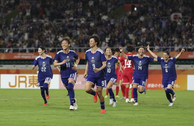 (261002) -- FUKUROI, Oct. 2, 2026 (Xinhua) -- Players of Japan celebrate scoring during the women's final match of football between Japan and the Democratic People's Republic of Korea (DPRK) at 20th Asian Games Aichi-Nagoya 2026 in Fukuroi of Shizuoka Prefecture, Japan, Oct. 2, 2026. (Xinhua/Jia Haocheng)