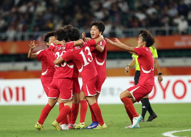 (261002) -- FUKUROI, Oct. 2, 2026 (Xinhua) -- Players of DPRK celebrate goal during the women's final match of football between Japan and the Democratic People's Republic of Korea (DPRK) at 20th Asian Games Aichi-Nagoya 2026 in Fukuroi of Shizuoka Prefecture, Japan, Oct. 2, 2026. (Xinhua/Jia Haocheng)