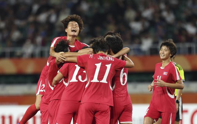 (261002) -- FUKUROI, Oct. 2, 2026 (Xinhua) -- Players of DPRK celebrate Jon Ryong Jong's goal during the women's final match of football between Japan and the Democratic People's Republic of Korea (DPRK) at 20th Asian Games Aichi-Nagoya 2026 in Fukuroi of Shizuoka Prefecture, Japan, Oct. 2, 2026. (Xinhua/Jia Haocheng)