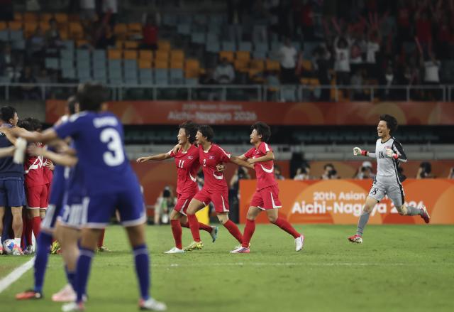 (261002) -- FUKUROI, Oct. 2, 2026 (Xinhua) -- Players of DPRK celebrate their goal after a VAR review during the women's final match of football between Japan and the Democratic People's Republic of Korea (DPRK) at 20th Asian Games Aichi-Nagoya 2026 in Fukuroi of Shizuoka Prefecture, Japan, Oct. 2, 2026. (Xinhua/Jia Haocheng)