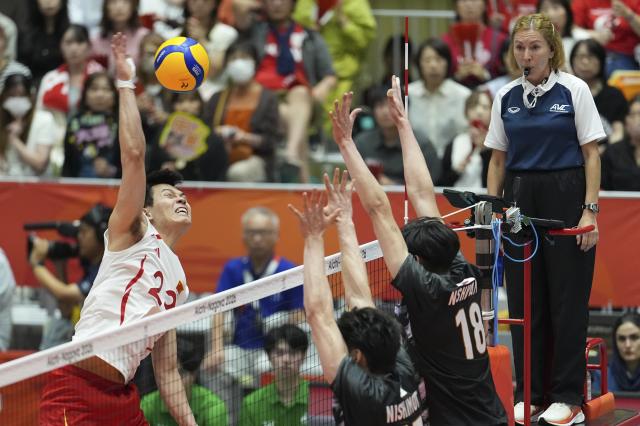 (261002) -- OKAZAKI, Oct. 2, 2026 (Xinhua) -- Wang Bin (1st L) of China spikes the ball during the men's volleyball semifinal match between China and Japan at the 20th Asian Games Aichi-Nagoya 2026 in Okazaki of Aichi Prefecture, Japan, Oct. 2, 2026. (Xinhua/Cheong Kam Ka)