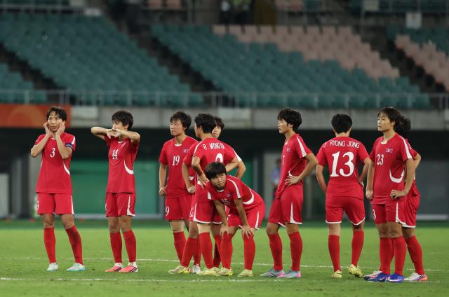 (261002) -- FUKUROI, Oct. 2, 2026 (Xinhua) -- Players of the Democratic People's Republic of Korea react after the women's final match of football between Japan and the Democratic People's Republic of Korea (DPRK) at 20th Asian Games Aichi-Nagoya 2026 in Fukuroi of Shizuoka Prefecture, Japan, Oct. 2, 2026. (Xinhua/Jia Haocheng)