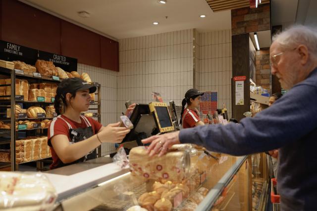 (261002) -- CANBERRA, Oct. 2, 2026 (Xinhua) -- Two young women work at a bakery in Canberra, Australia, on Oct. 2, 2026. TO GO WITH "Job vacancies fall again in Australia" (Photo by Chu Chen/Xinhua)