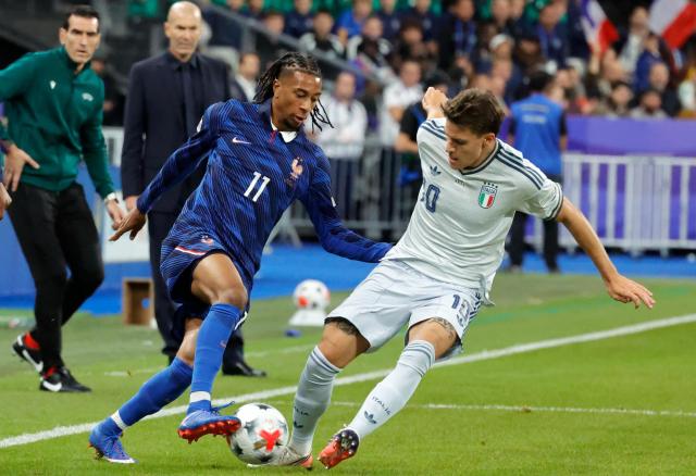 (261003) -- PARIS, Oct. 3, 2026 (Xinhua) -- France's Michael Olise (L) vies with Italy's Nicolo Fagioli during the UEFA Nations League 2026/27 League A Group A1 match between France and Italy in Paris, France, Oct. 2, 2026. (Photo by Henri Szwarc/Xinhua)