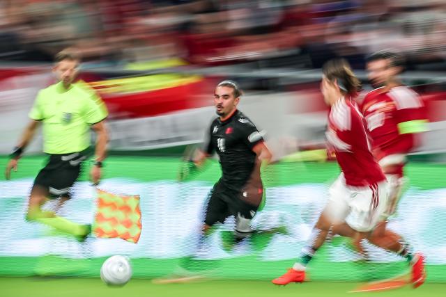 (261003) -- BUDAPEST, Oct. 3, 2026 (Xinhua) -- Irakli Egoyan (C) of Georgia dribbles the ball during the UEFA Nations League 2026/27 League B Group B2 match between Hungary and Georgia in Budapest, Hungary, Oct. 2, 2026. (Photo by David Balogh/Xinhua)