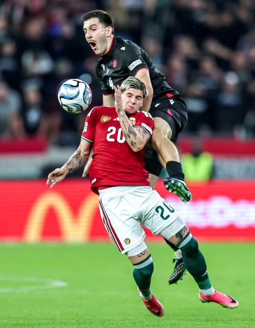 (261003) -- BUDAPEST, Oct. 3, 2026 (Xinhua) -- Milan Toth (bottom) of Hungary vies with Luka Lochoshvili of Georgia during the UEFA Nations League 2026/27 League B Group B2 match between Hungary and Georgia in Budapest, Hungary, Oct. 2, 2026. (Photo by David Balogh/Xinhua)