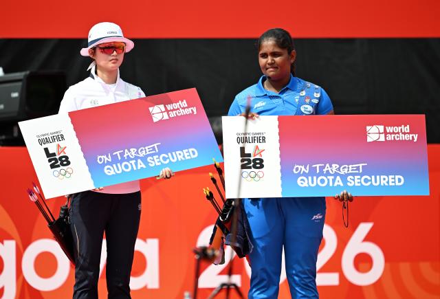 (261003) -- OKAZAKI, Oct. 3, 2026 (Xinhua) -- Oh Yejin (L) of South Korea and Kumkum Anil Mohod of India celebrate securing one quota place each for the Los Angeles 2028 Olympic Games after their Recurve Women's Individual Gold Medal Match of Archery at the 20th Asian Games Aichi-Nagoya 2026 in Okazaki of Aichi Prefecture, Japan, Oct. 3, 2026. (Xinhua/Yu Yang)
