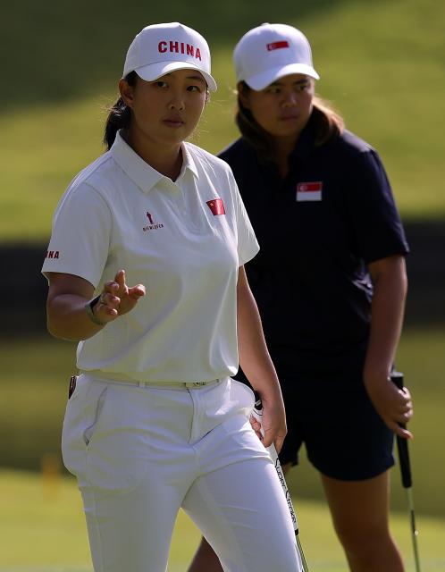 (261003) -- KASUGAI, Oct. 3, 2026 (Xinhua) -- Yin Ruoning (L) of China reacts during the Women's Individual Stroke Play Round 4 of Golf at 20th Asian Games Aichi-Nagoya 2026 in Kasugai of Aichi Prefecture, Japan, Oct. 3, 2026. (Xinhua/Li Bo)