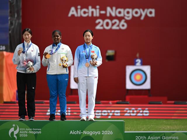 (261003) -- OKAZAKI, Oct. 3, 2026 (Xinhua) -- Gold medalist Kumkum Anil Mohod (C) of India, silver medalist Oh Yejin (L) of South Korea and bronze medalist Huang Yuwei of China pose during the victory ceremony for the Recurve Women's Individual of Archery at the 20th Asian Games Aichi-Nagoya 2026 in Okazaki of Aichi Prefecture, Japan, Oct. 3, 2026. (Xinhua/Yu Yang)