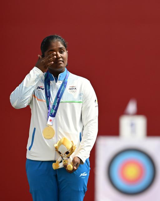 (261003) -- OKAZAKI, Oct. 3, 2026 (Xinhua) -- Gold medalist Kumkum Anil Mohod of India reacts during the victory ceremony for the Recurve Women's Individual of Archery at the 20th Asian Games Aichi-Nagoya 2026 in Okazaki of Aichi Prefecture, Japan, Oct. 3, 2026. (Xinhua/Yu Yang)