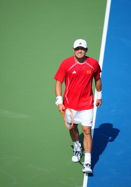 (261003) -- NAGOYA, Oct. 3, 2026 (Xinhua) -- Wu Yibing of China reacts during the Men's Singles Gold Medal Match of Tennis between Wu Yibing of China and Wong Coleman of Hong Kong, China at the 20th Asian Games Aichi-Nagoya 2026 in Nagoya, Japan, Oct. 3, 2026. (Xinhua/Chen Zeguo)