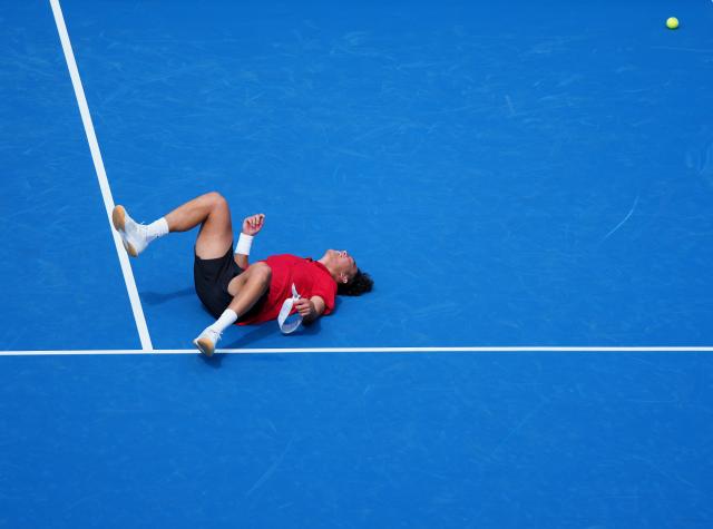 (261003) -- NAGOYA, Oct. 3, 2026 (Xinhua) -- Wong Coleman celebrates after the Men's Singles Gold Medal Match of Tennis between Wu Yibing of China and Wong Coleman of Hong Kong, China at the 20th Asian Games Aichi-Nagoya 2026 in Nagoya, Japan, Oct. 3, 2026. (Xinhua/Chen Zeguo)