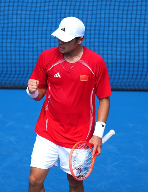 (261003) -- NAGOYA, Oct. 3, 2026 (Xinhua) -- Wu Yibing of China celebrates during the Men's Singles Gold Medal Match of Tennis between Wu Yibing of China and Wong Coleman of Hong Kong, China at the 20th Asian Games Aichi-Nagoya 2026 in Nagoya, Japan, Oct. 3, 2026. (Xinhua/Chen Zeguo)