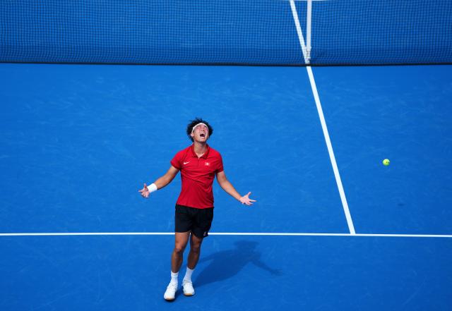 (261003) -- NAGOYA, Oct. 3, 2026 (Xinhua) -- Wong Coleman celebrates after the Men's Singles Gold Medal Match of Tennis between Wu Yibing of China and Wong Coleman of Hong Kong, China at the 20th Asian Games Aichi-Nagoya 2026 in Nagoya, Japan, Oct. 3, 2026. (Xinhua/Chen Zeguo)
