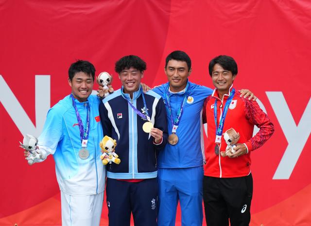 (261003) -- NAGOYA, Oct. 3, 2026 (Xinhua) -- Gold medalist Wong Coleman (2nd L) of China's Hong Kong, silver medalist Wu Yibing (1st L) of China and bronze medalists Khumoyun Sultanov (2nd R) of Uzbekistan and Matsuoka Hayato of Japan pose during the victory ceremony for the Men's Singles of Tennis at the 20th Asian Games Aichi-Nagoya 2026 in Nagoya, Japan, Oct. 3, 2026. (Xinhua/Chen Zeguo)