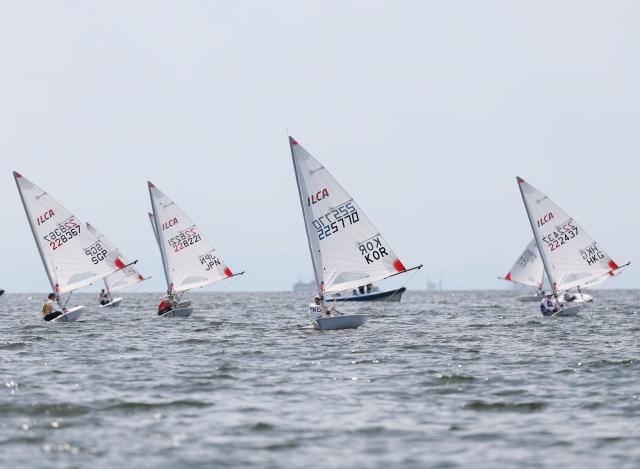 (261003) -- GAMAGORI, Oct. 3, 2026 (Xinhua) -- Sailors compete during the Boys' Dinghy Opening Series Race of Sailing at the 20th Asian Games Aichi-Nagoya 2026 in Gamagori of Aichi Prefecture, Japan, Oct. 3, 2026. (Xinhua/Deng Hua)