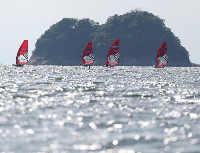 (261003) -- GAMAGORI, Oct. 3, 2026 (Xinhua) -- Sailors compete during the Boys' Windsurfing Opening Series Race of Sailing at the 20th Asian Games Aichi-Nagoya 2026 in Gamagori of Aichi Prefecture, Japan, Oct. 3, 2026. (Xinhua/Deng Hua)