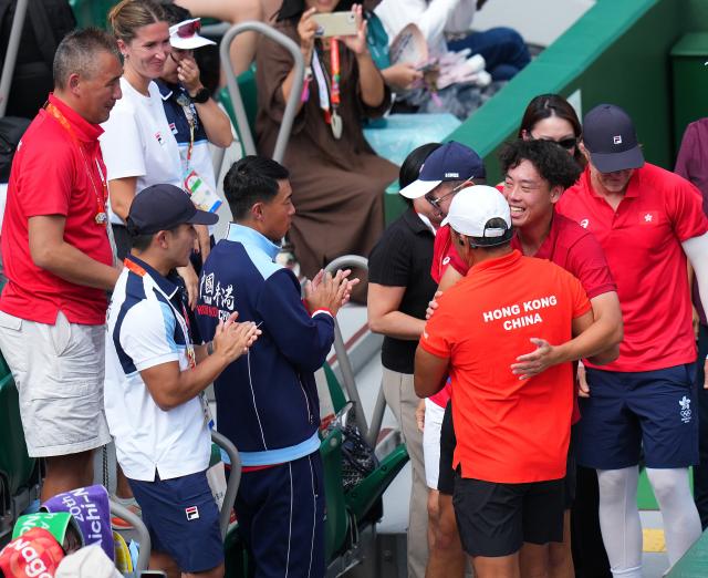 (261003) -- NAGOYA, Oct. 3, 2026 (Xinhua) -- Wong Coleman (3rd R) of China's Hong Kong celebrates after the Men's Singles Gold Medal Match of Tennis between Wu Yibing of China and Wong Coleman of China's Hong Kong at the 20th Asian Games Aichi-Nagoya 2026 in Nagoya, Japan, Oct. 3, 2026. (Xinhua/Chen Zeguo)